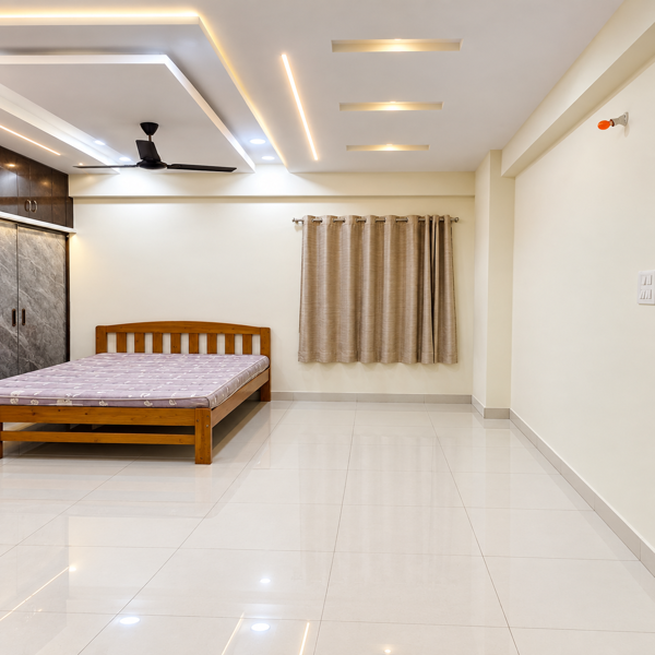 Traditional bedroom, classic bedroom, wooden bed, carved wooden bed, ornate headboard, master bedroom, bedroom interior, traditional Indian bedroom, Indian home interior, brown wardrobe, glossy wardrobe, marble finish wardrobe, built in wardrobe, large wardrobe, bedroom storage, wardrobe cabinets, sliding wardrobe, overhead storage, wood finish, dark brown wood, beige marble texture, cream wardrobe, decorative headboard, carved furniture, wooden furniture, king size bed, floral mattress, bedroom furnishings, ceiling fan, false ceiling, recessed lights, LED strip lighting, warm lighting, polished floor, glossy tiles, spacious bedroom, classic interior, elegant bedroom, luxury bedroom, traditional decor, contemporary amenities, modern wardrobe, custom wardrobe, bespoke furniture, bedroom cabinetry, storage cabinets, residential interior, Indian house design, modern Indian home, home decor, interior design, bedroom design, home renovation, bedroom makeover, furniture design, carpentry, wood craftsmanship, ornate furniture, decorative woodwork, carved details, classic styling, warm neutral palette, cream walls, brown interiors, marble laminate, wardrobe doors, cabinet handles, bedroom organization, functional storage, premium interior, sophisticated decor, traditional styling, family bedroom, comfortable bedroom, residential bedroom, apartment bedroom, spacious home, home furnishing, interior inspiration, home decor ideas, elegant home, designer bedroom, custom cabinetry, luxury bedroom design, modern classic interior, timeless interior, polished surfaces, clean flooring, ceiling lighting, ambient lighting, wardrobe design ideas, bedroom furniture ideas, Indian interior design, home styling, bedroom photography, classic home decor, refined interiors, functional bedroom, large storage wardrobe, wood and marble bedroom.